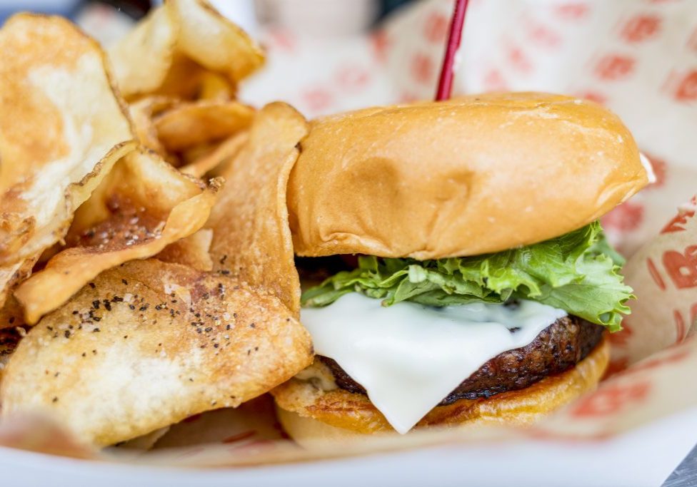 A hot and fresh burger and chips from Burgatory at Acrisure Stadium.
